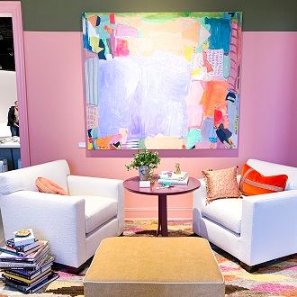White chairs with pink wall and bold art & accents